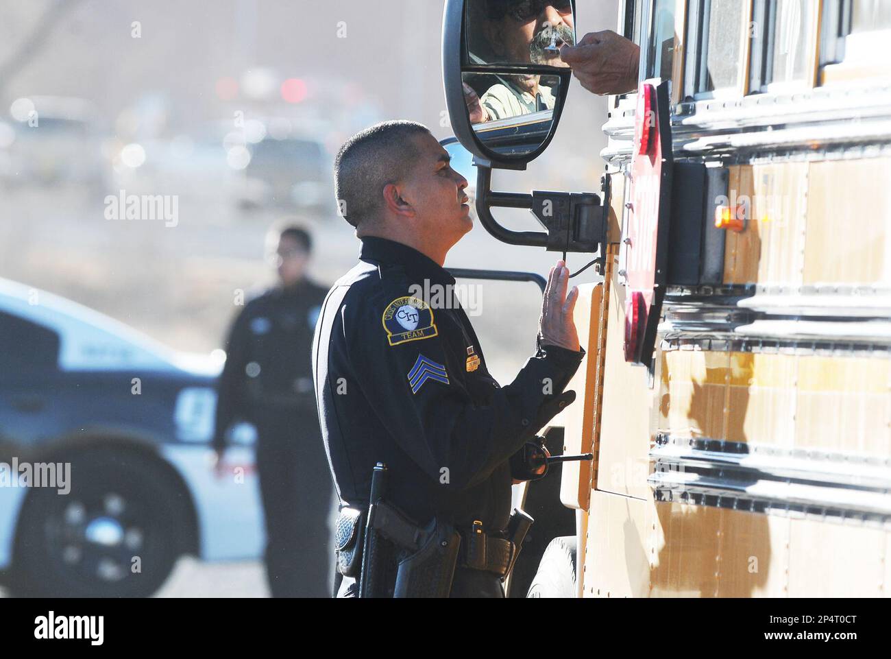 Law enforcement personnel set up a perimeter following a shooting at