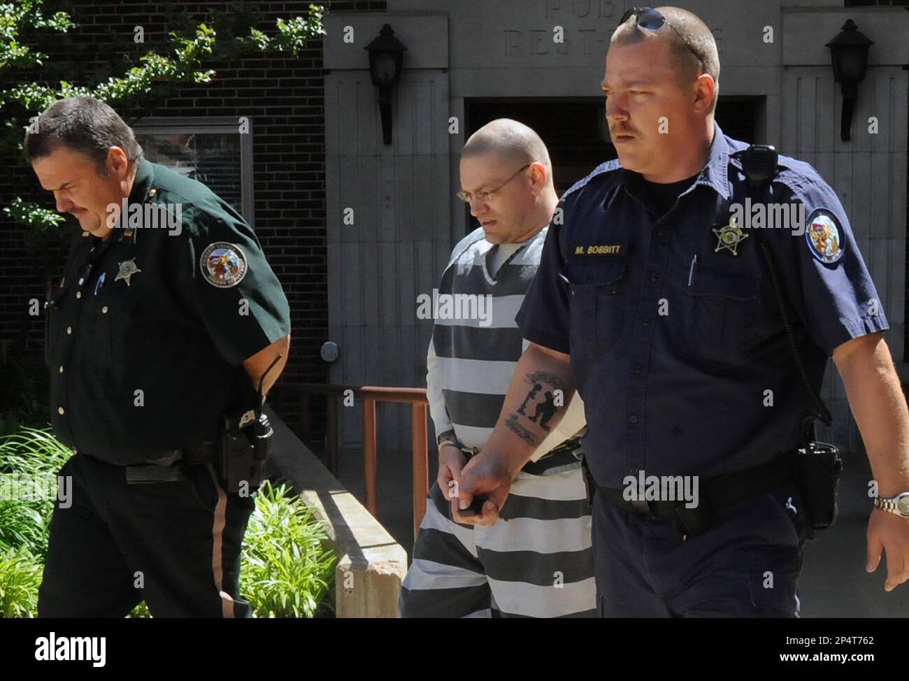 FILE In this April 19, 2012, file photo, Jerry D. Lard, center, is