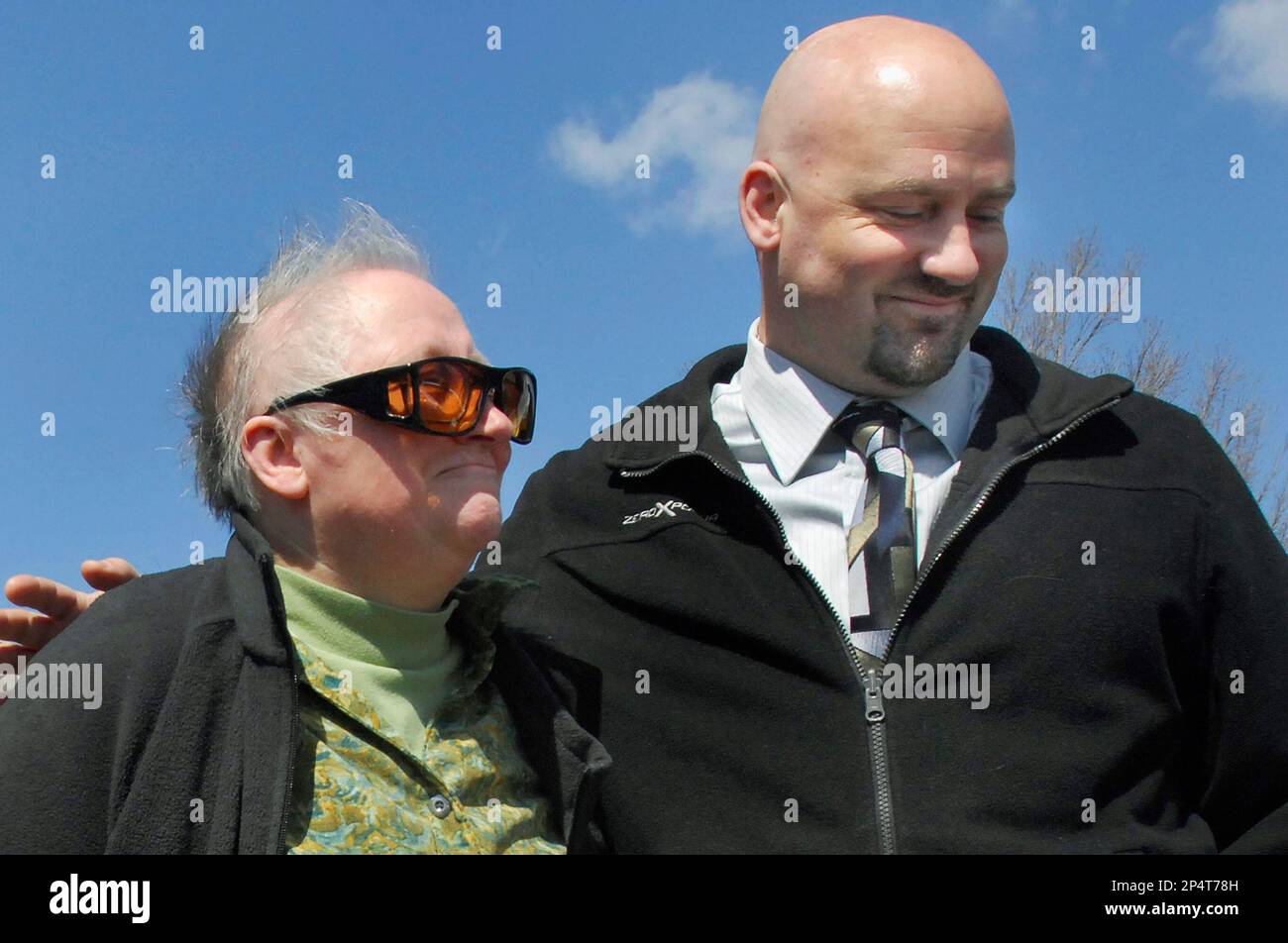 FILE In this April 25, 2013 file photo, Alan Beaman right, hugs his