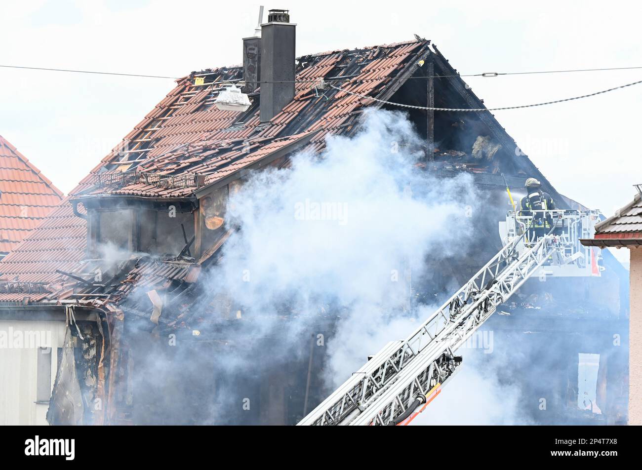 Stuttgart, Germany. 06th Mar, 2023. At the scene of the accident in Stuttgart  West, firefighters extinguish the fire and search for a missing 85-year-old  resident. After an explosion in the night in