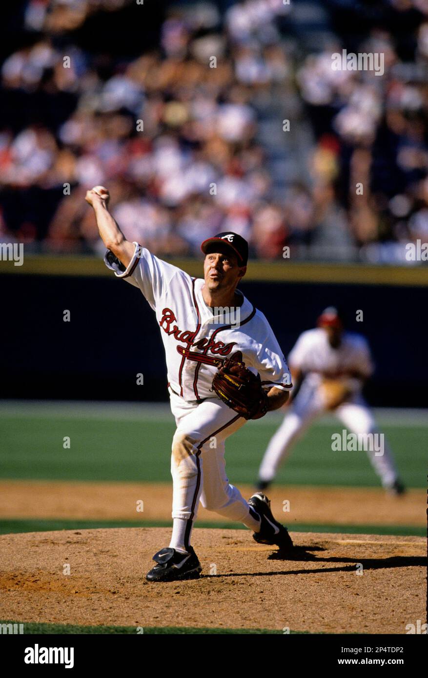 Atlanta Braves pitcher Greg Maddux pitches during a game. Circa Braves  (93-03) (AP Photo/Tom DiPace Stock Photo - Alamy