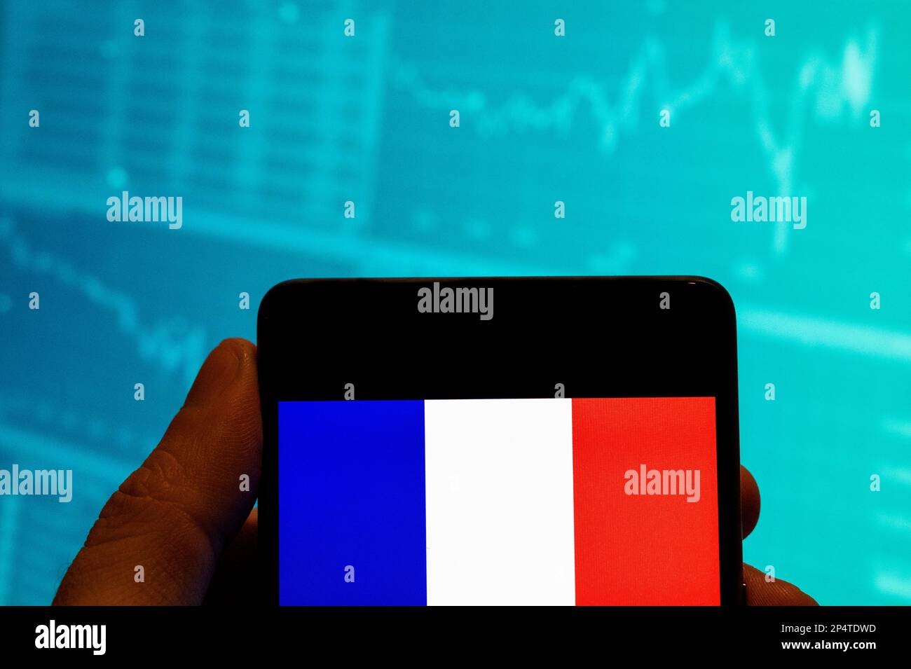 China. 19th Feb, 2023. In this photo illustration, the French Republic flag is seen displayed on a smartphone with an economic stock exchange index graph in the background. Credit: SOPA Images Limited/Alamy Live News Stock Photo