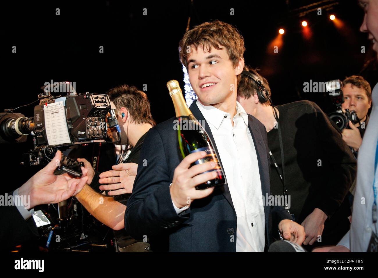 world-chess-champion-magnus-carlsen-left-celebrates-during-an-awards-ceremony-at-a-norwegian-sports-gala-event-in-oslo-saturday-jan-4-2014-lord-coe-chairman-of-the-british-olympic-association-and-former-athlete-steinar-hoen-neither-are-in-photo-handed-him-the-name-of-the-year-2013-award-at-the-ceremony-ap-photo-audun-braastad-ntb-norway-out-2P4THF9.jpg
