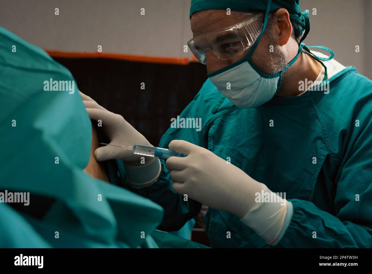 Surgeon Inject Anesthesia With Syringe Into The Patient Before Perform