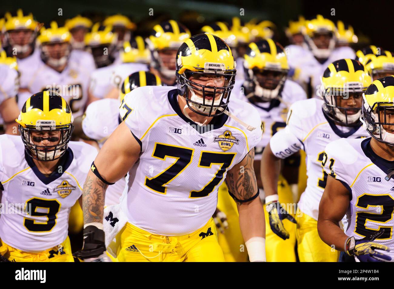 December 28, 2103: Michigan Wolverines offensive linesman Taylor Lewan (77)  before the Buffalo Wild Wings Bowl NCAA football game between the Michigan  Wolverines and the Kansas State Wildcats at Sun Devil Stadium