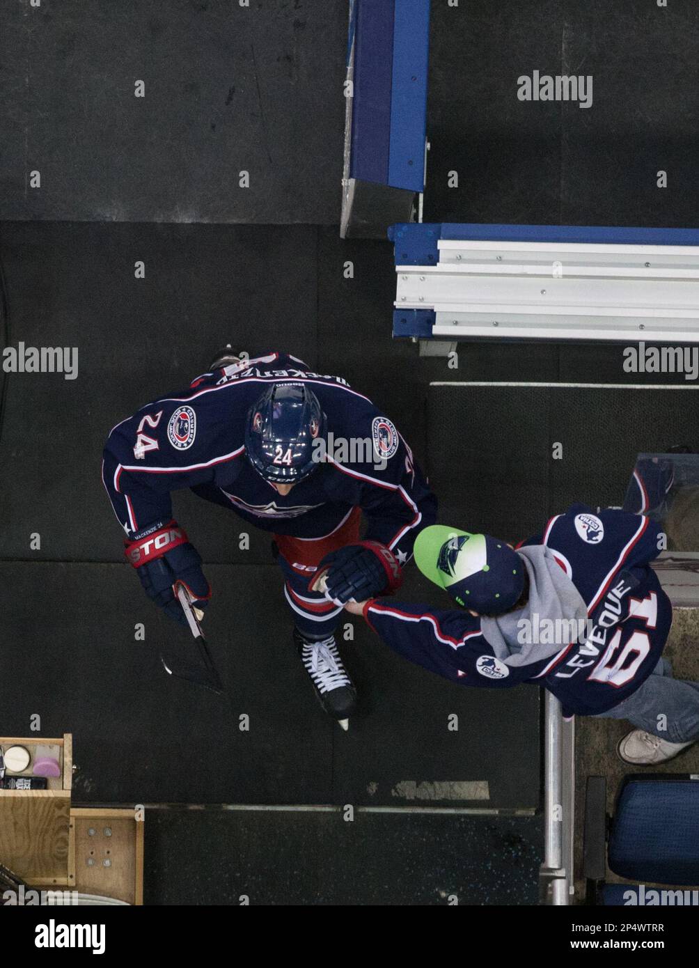 Dec. 10, 2013 - Columbus, OH, United States of America - Columbus Blue  Jackets center Derek MacKenzie (24) high fives a fan during warmups prior  to the NHL game between the New