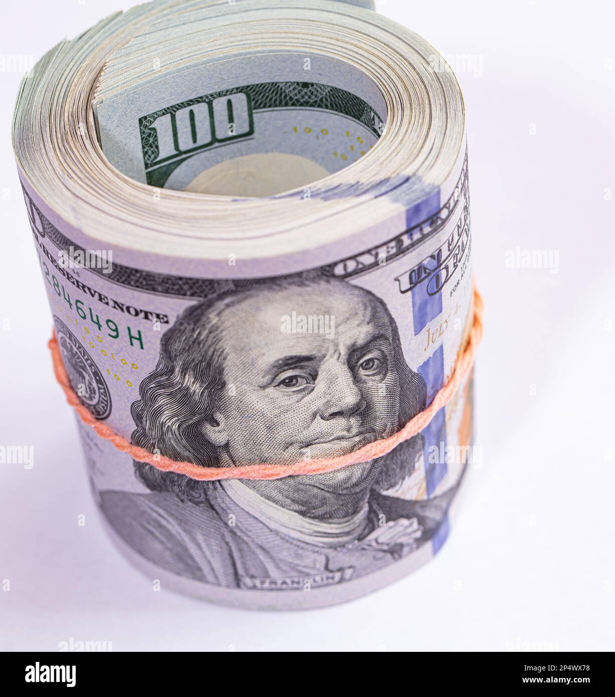 roll of 100 dollar banknotes on white background for design purpose ...