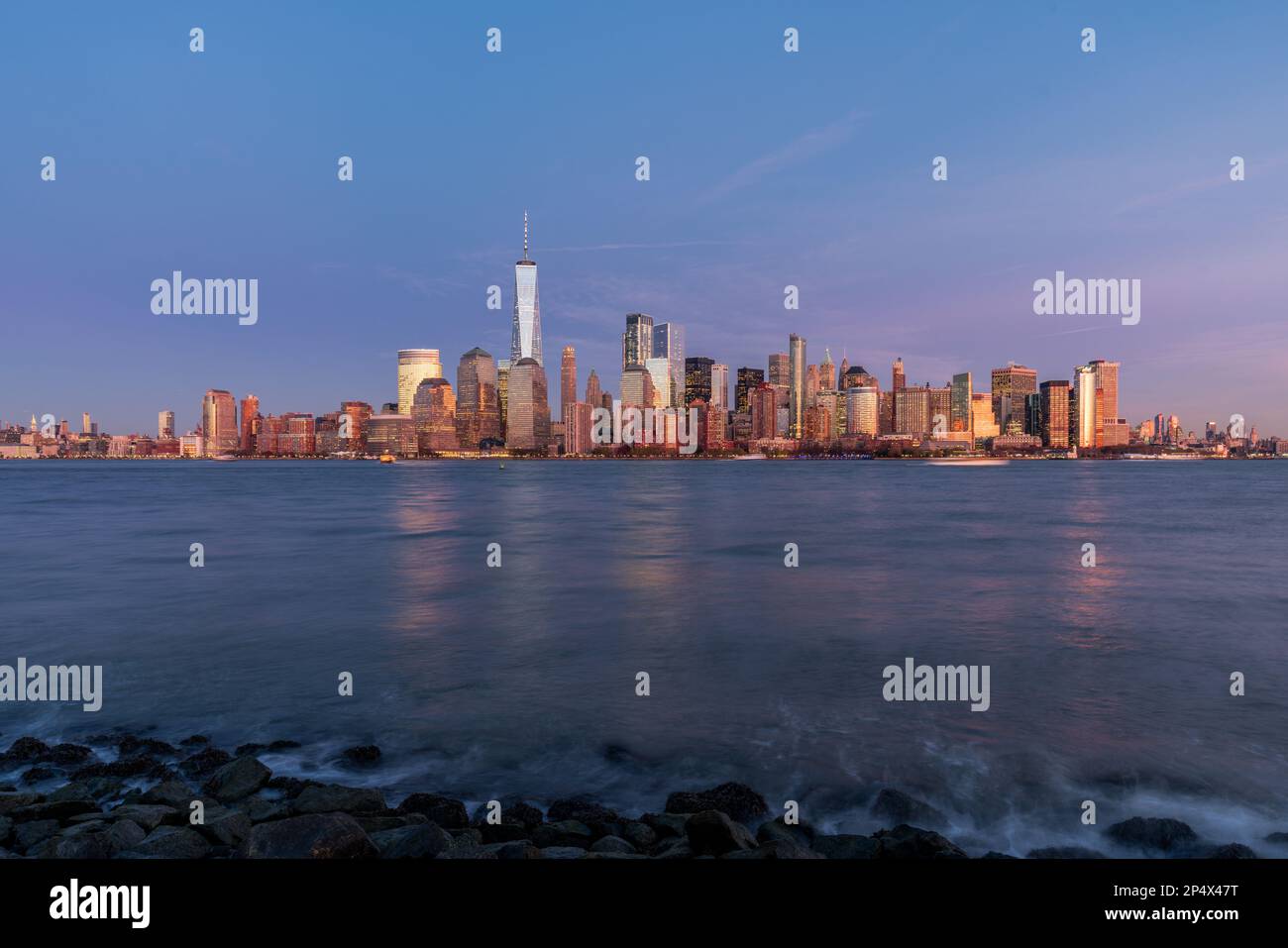 Manhattan city skyline with water in front, cityscapes of New York at ...