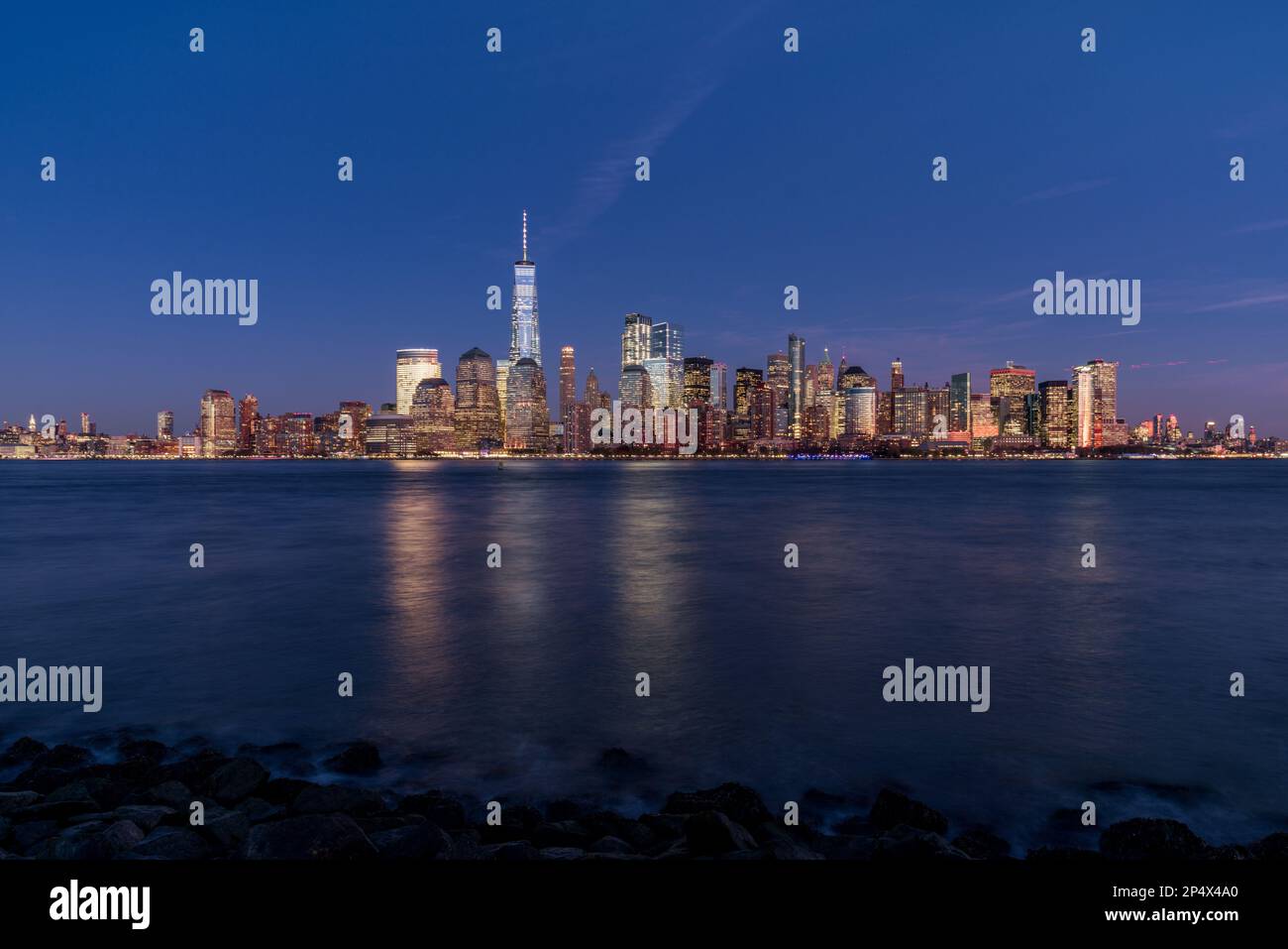 Manhattan city skyline with water in front, cityscapes of New York at ...