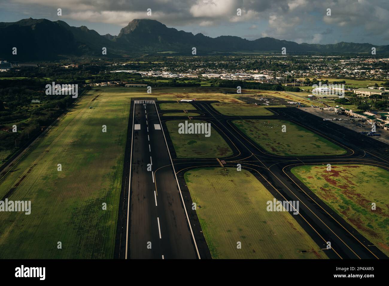 Aerial view of the runway and plane hangars of Lihue airport on Kauai island, Hawaii, United States - sep 2022. High quality photo Stock Photo