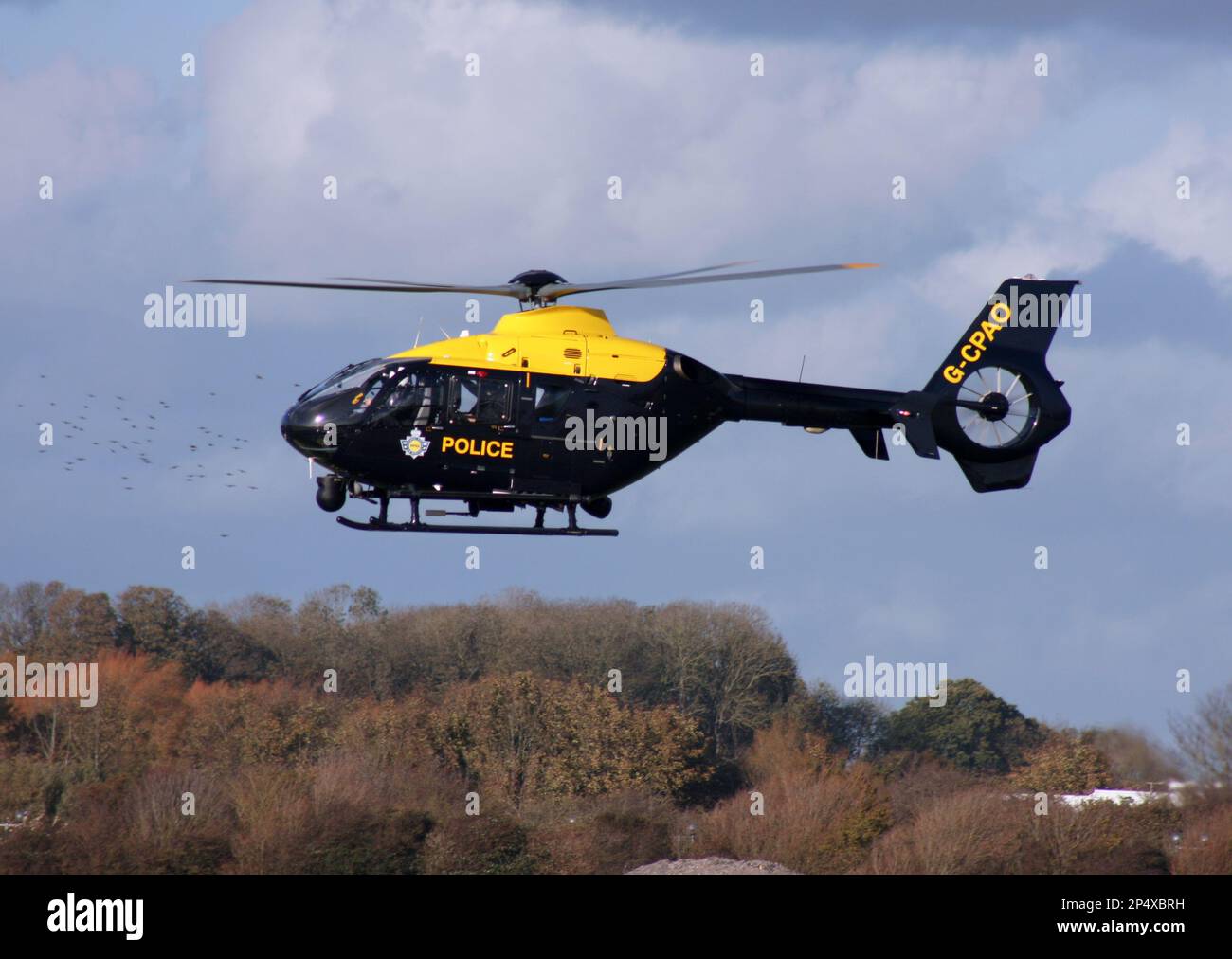 A Eurocopter EC 135P2+ of the UK Police Force arrives at Brighton City Airport Sussex England Stock Photo