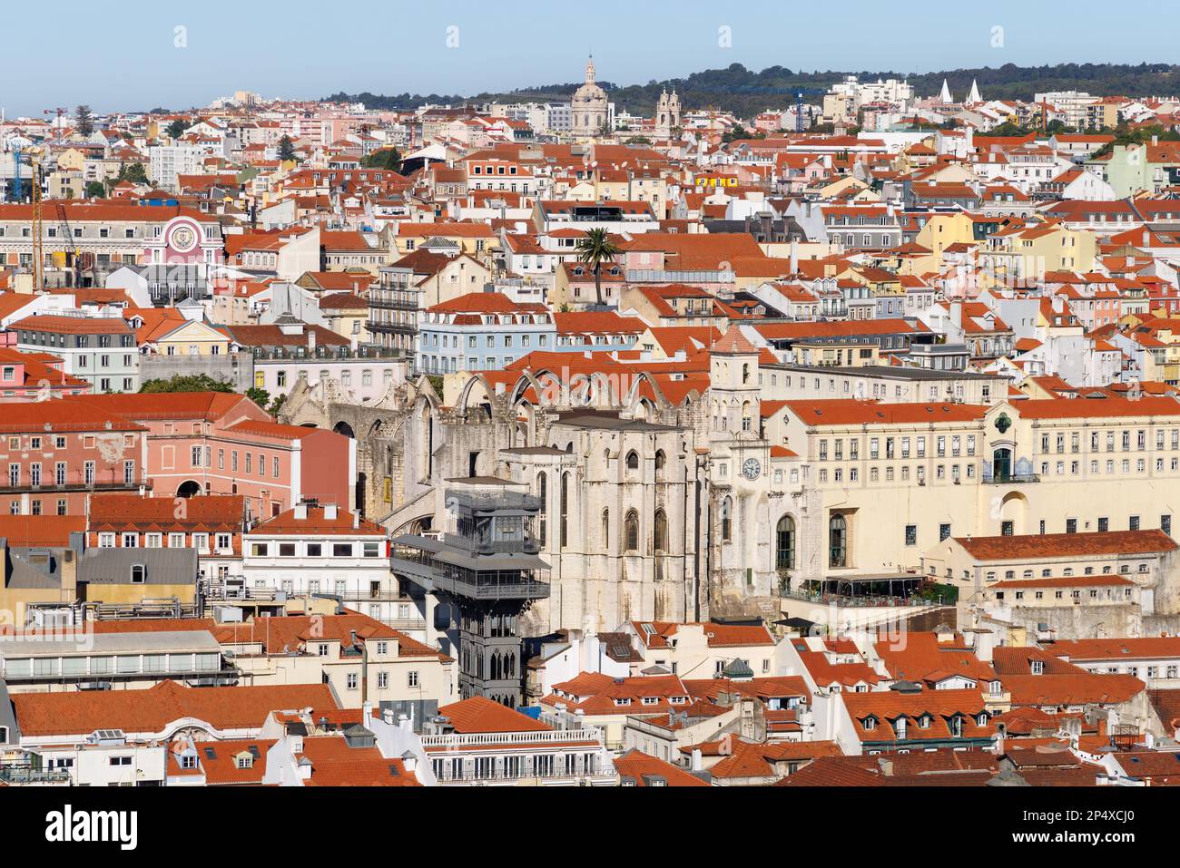 Lisbon, capital of Portugal. Cityscape with Santa Justa Lift, Elevador de Santa Justa and ruined Carmo Church. Rooftop view over historic downtown. Stock Photo