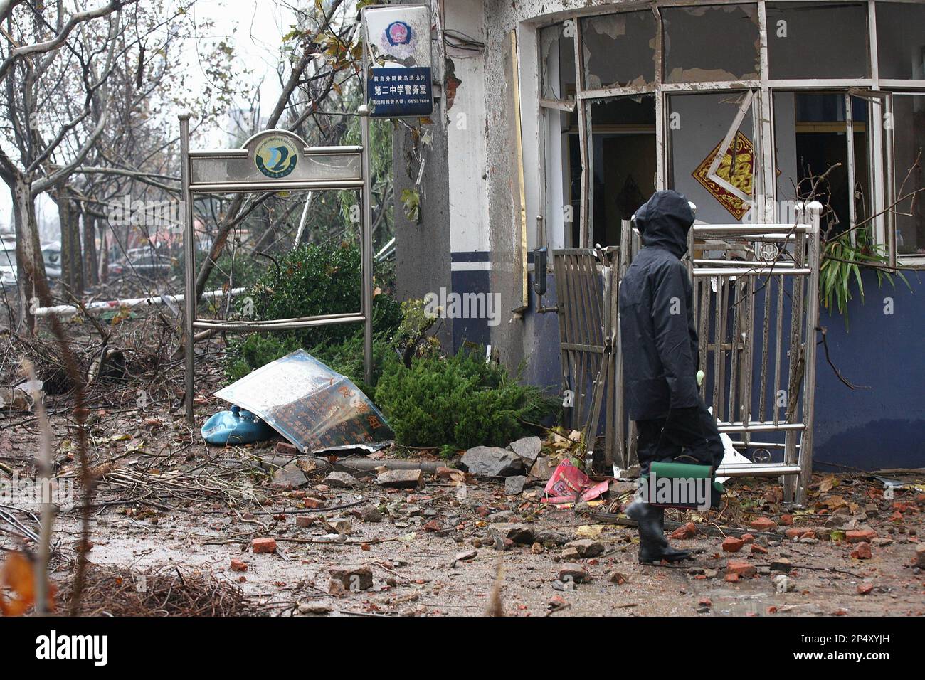 Rescuers work at a damaged middle school after a pipeline explosion in