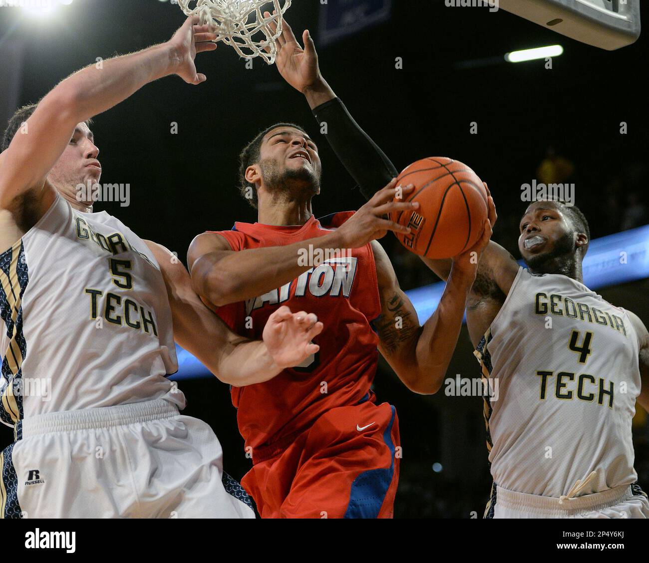 Dayton's Devin Oliver (5) drives the ball to the basket between