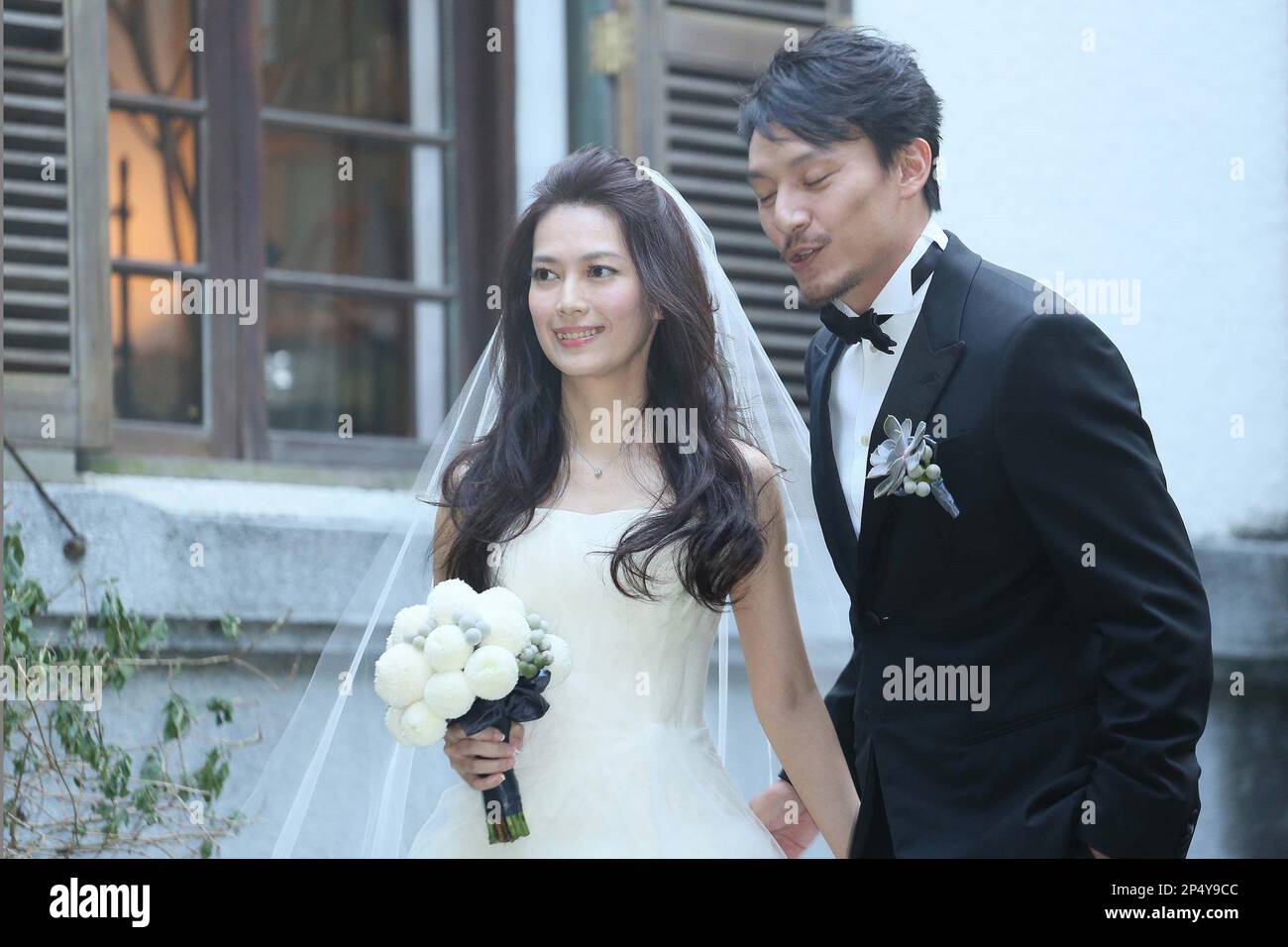Chang Chen and his wife pose for camera in Taipei,China on Monday