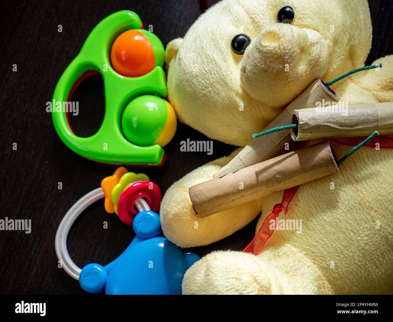 petards and firecrackers and toddler toys close up, conceptual photo of danger for kids Stock Photo