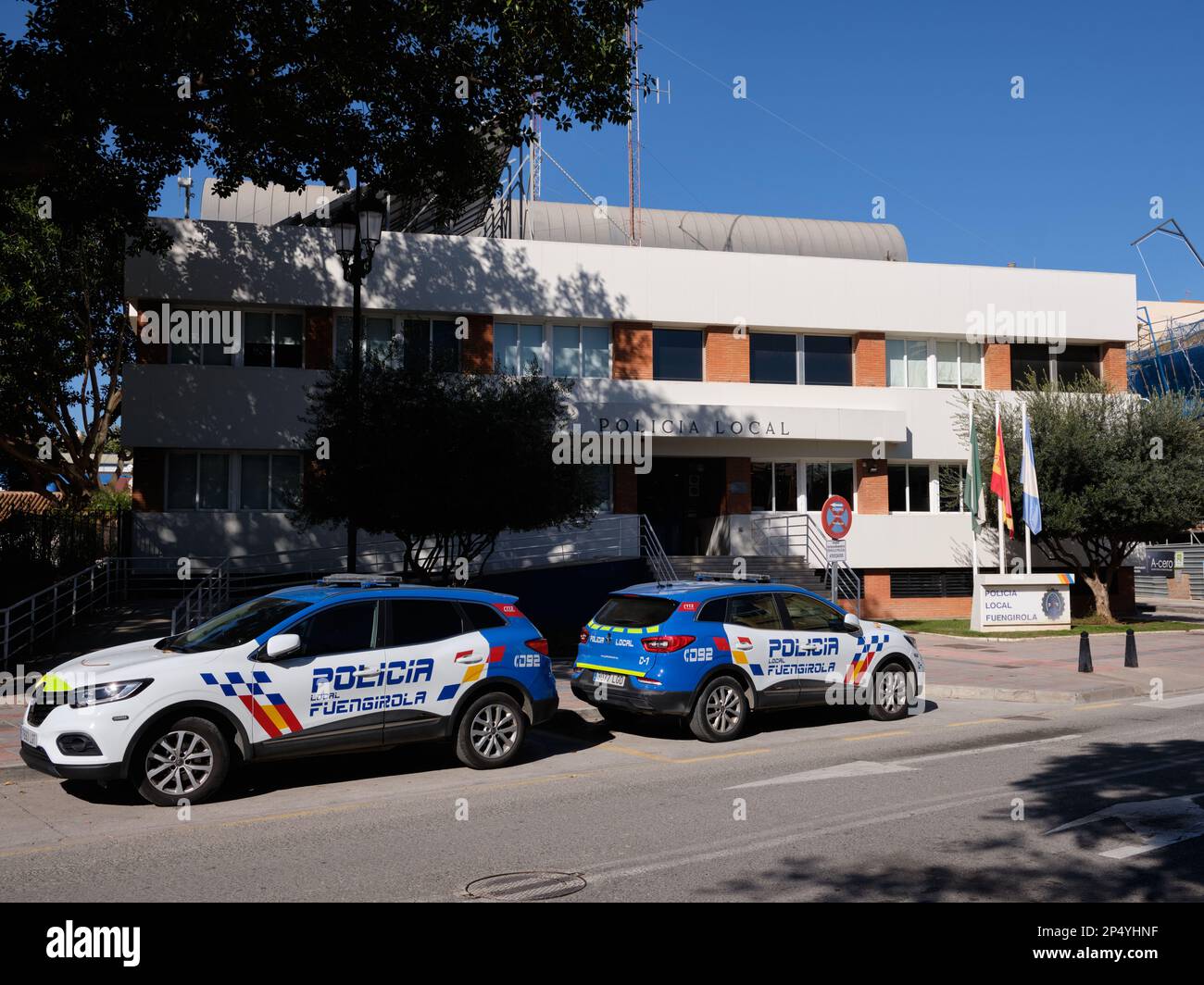 Two police cars parked in front of the police station of Fuengirola, Málaga, Spain. Stock Photo