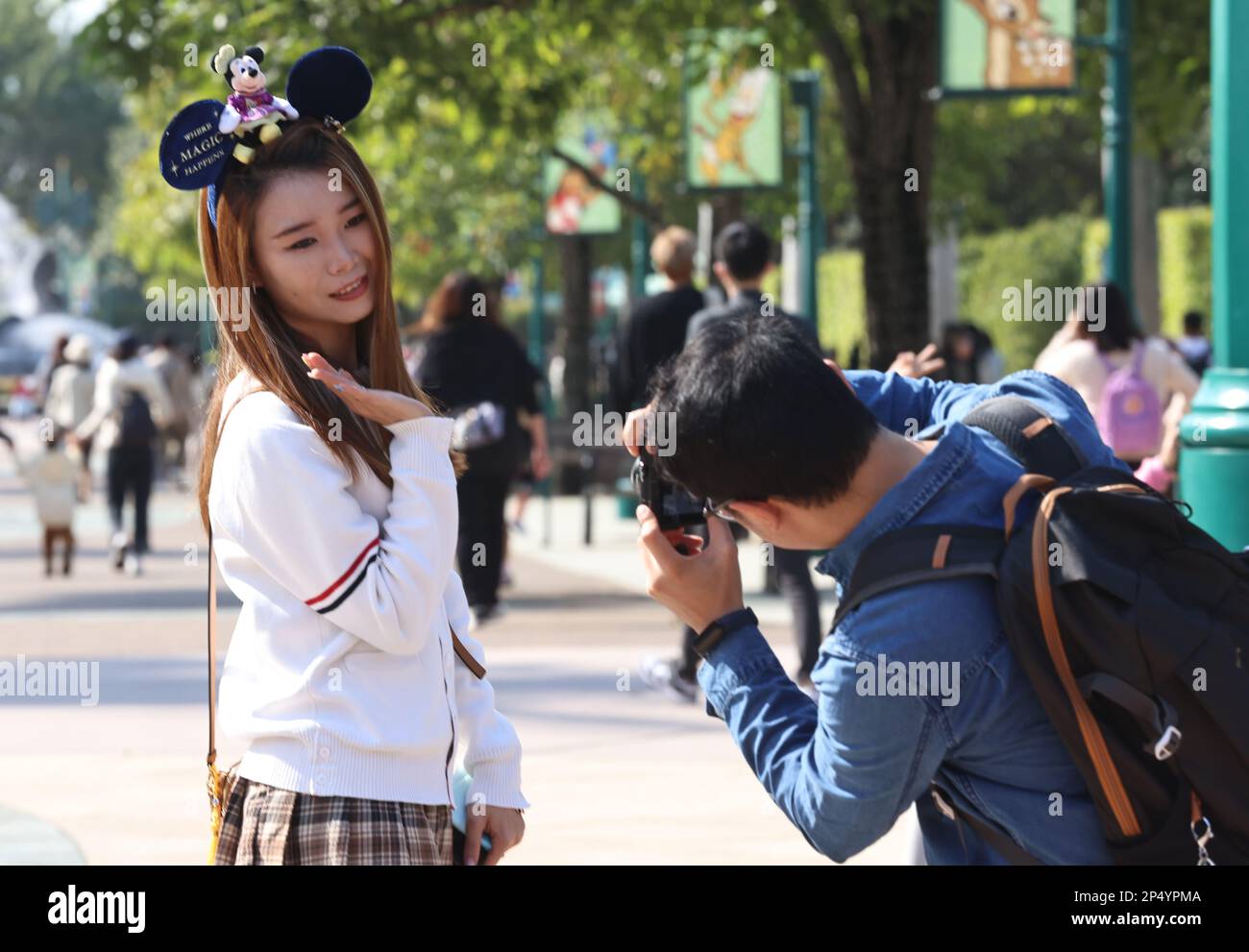 Visitors are pictured at Hong Kong Disneyland on the first maskfree