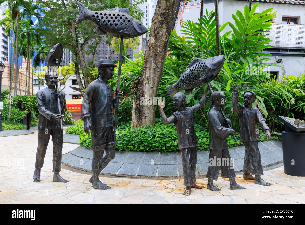 Sculpture depicting the festival activities of early Chinese immigrants in Singapore, Telok Ayer Green, Singapore Stock Photo