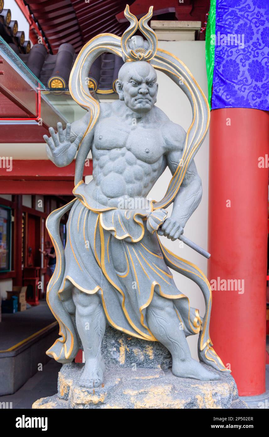 Nio Nārāyaṇa (guardian) at the front entrance of the Buddha Tooth Relic Temple, Chinatown, Singapore Stock Photo