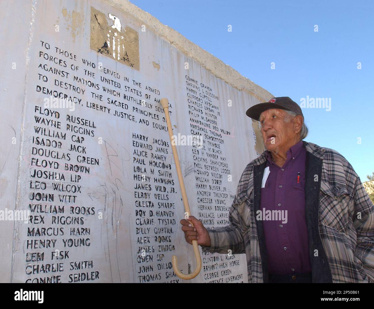 In this Oct. 22, 2003 photo, Clarence Wolf Guts taps with his cane on