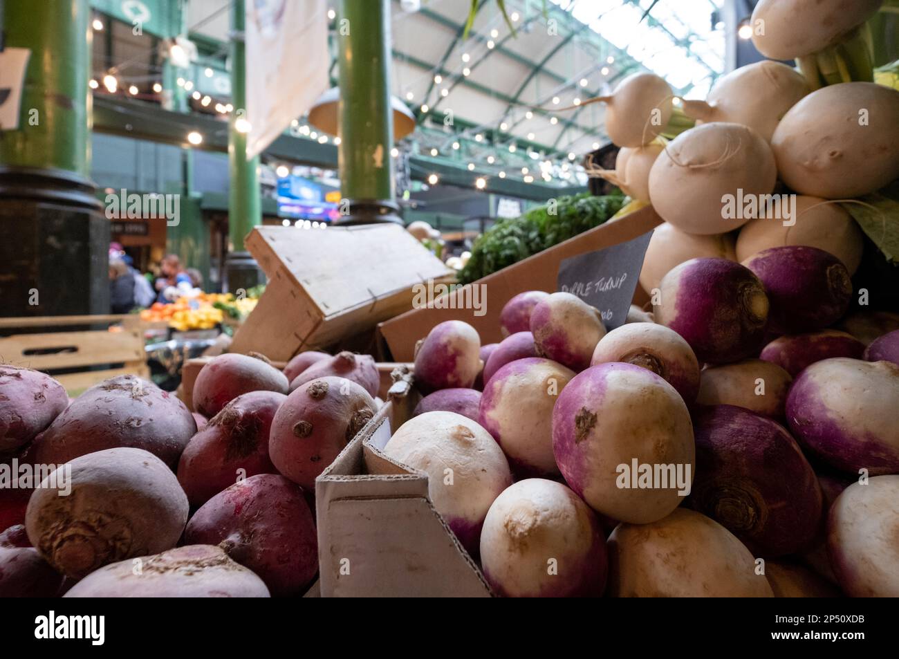 Vegetables, including turnips, for sale at market stall at Borough