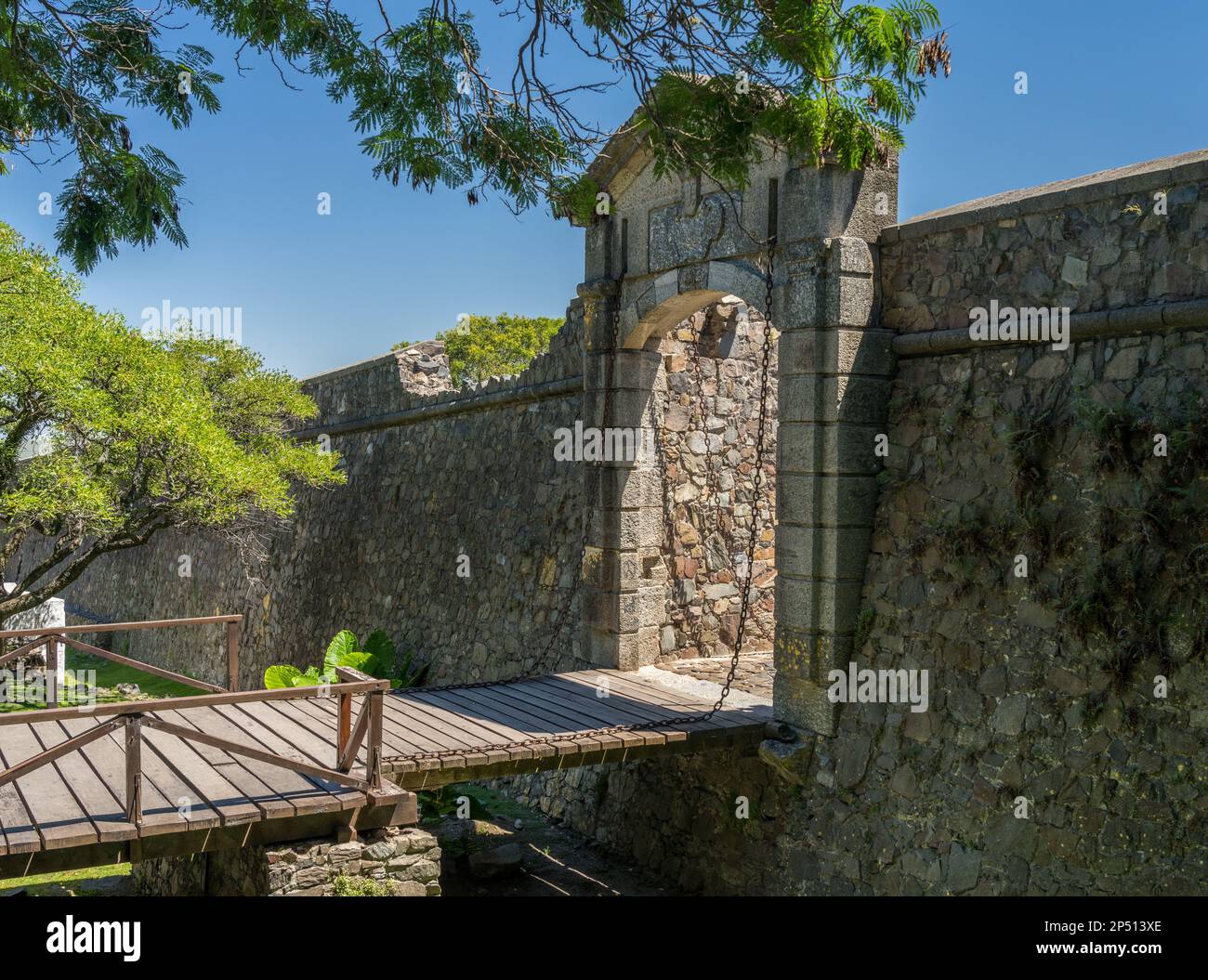 Stone arch and drawbridge leading into Unesco town of Colonia del ...