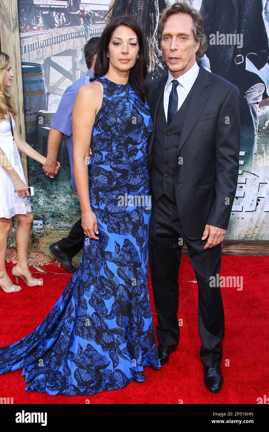Actor William Fichtner (R) and Kymberly Kalil attend the premiere Of