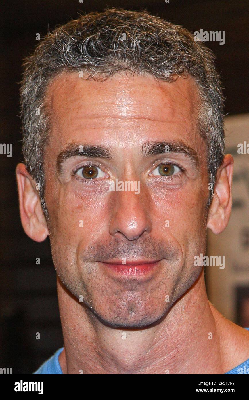 Author Dan Savage signs copies of his book "American Savage" at Barnes