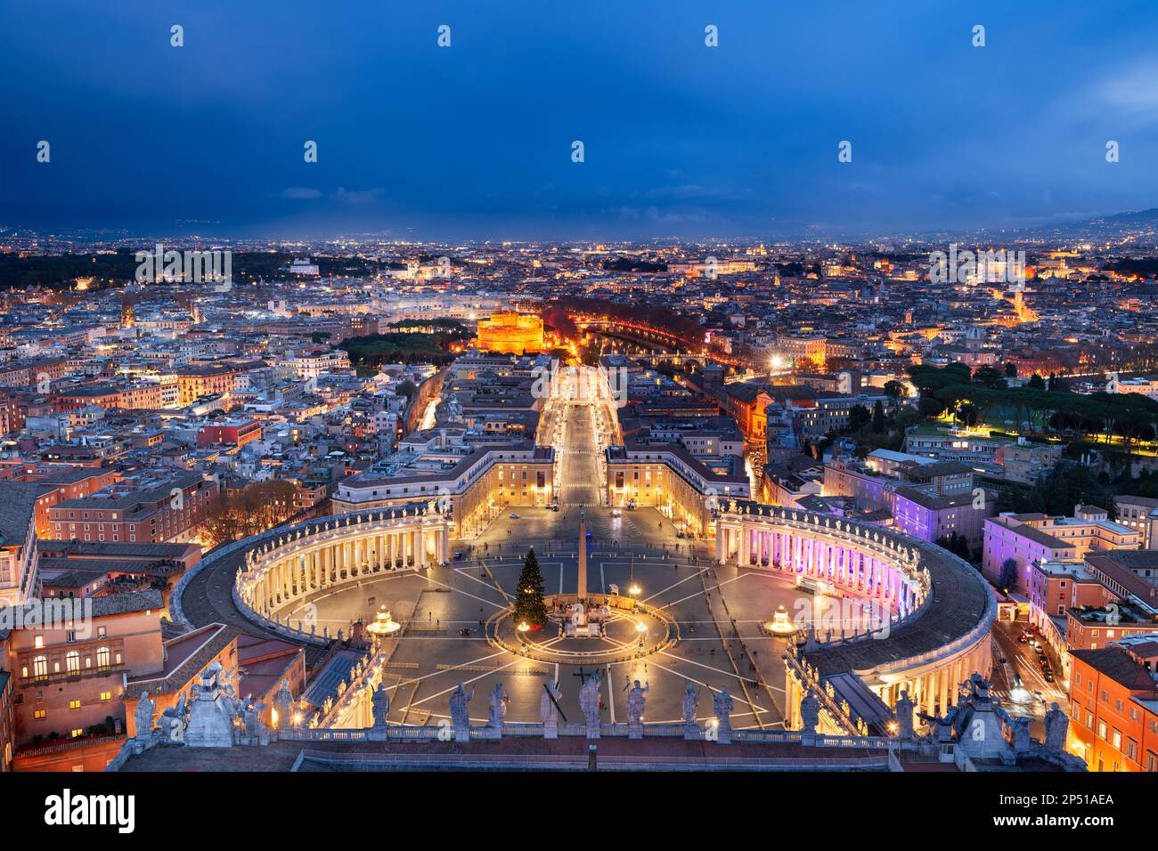 Vatican City overlooking St. Peter's Square surrounded by Rome, Italy at dusk. Stock Photo