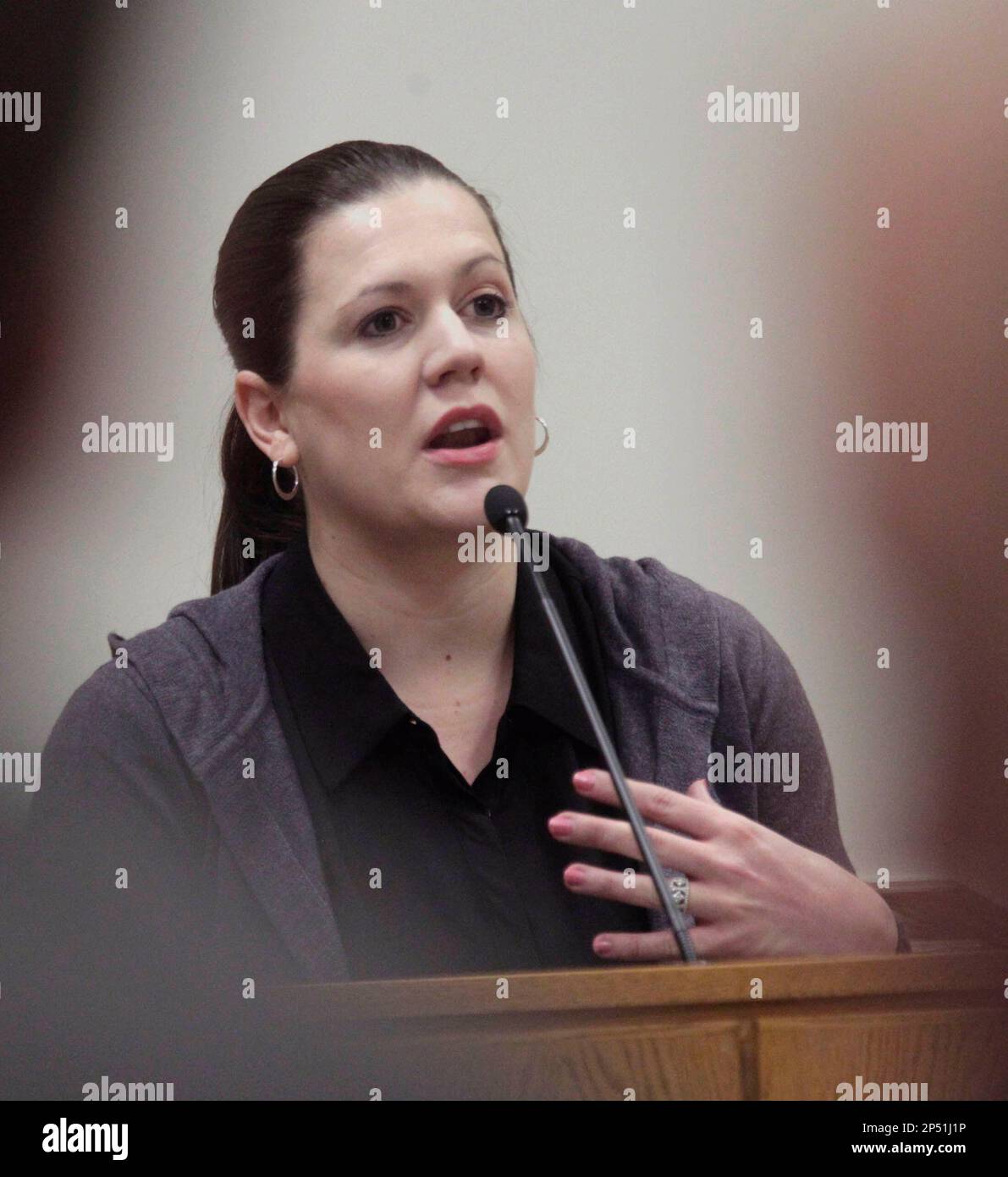 Alexis Sommers, daughter of Martin MacNeill, testifies in his trial in the  4th District Court on Thursday, Oct. 24, 2013 in Provo, Utah. Sommers and  her other sister Rachel Macneill, testified Thursday