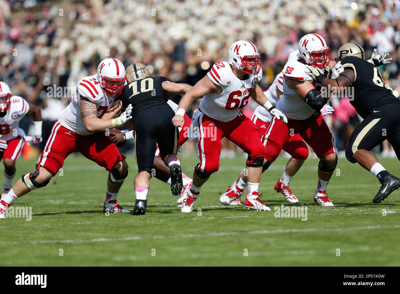 Nebraska offensive lineman Mike Moudy (74) and Nebraska offensive