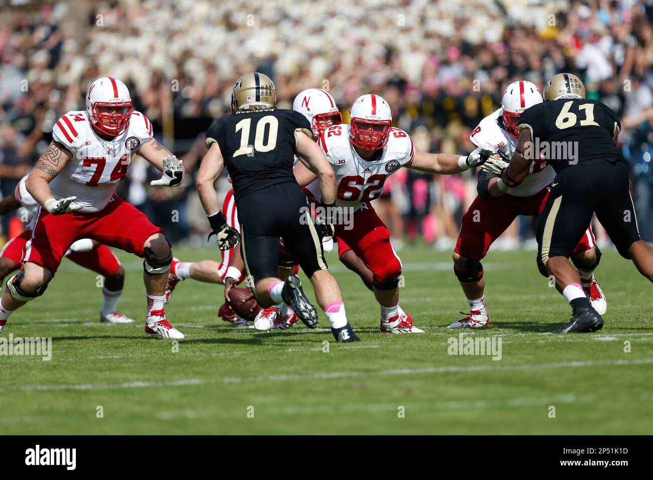 Nebraska offensive lineman Mike Moudy (74) and Nebraska offensive