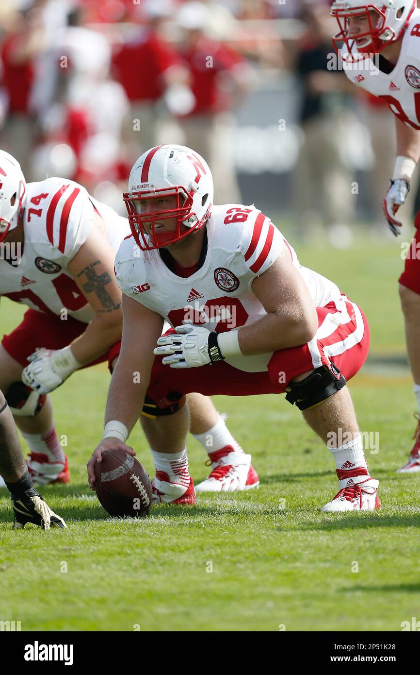 Nebraska offensive lineman Cole Pensick (62) gets ready to snap the