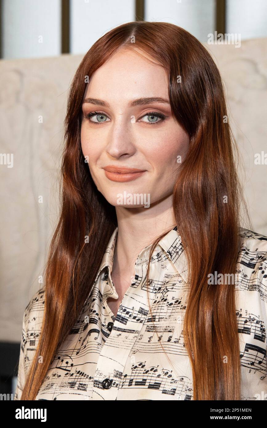 Sophie Turner poses for photographers following the Louis Vuitton Fall