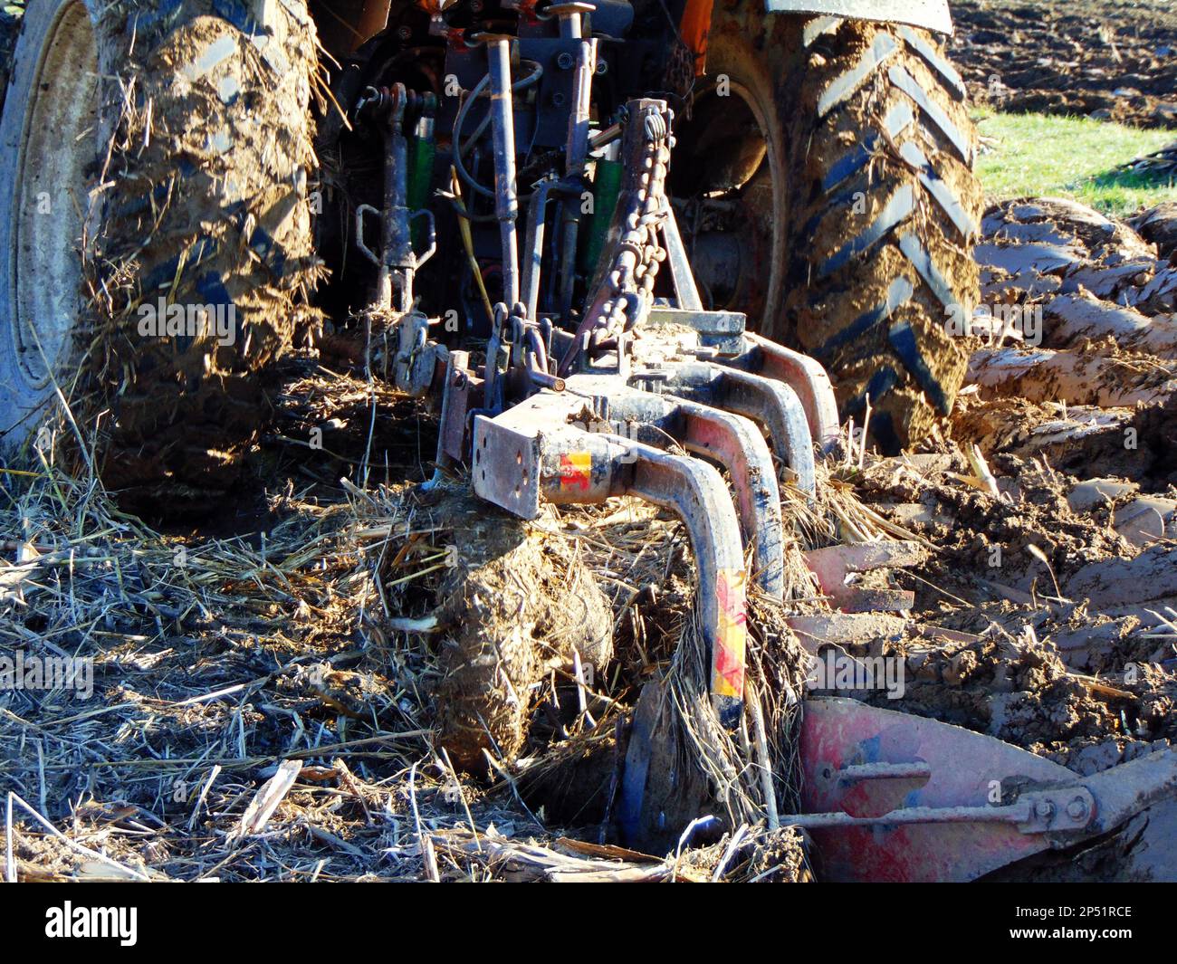 tractor on the field at farm Stock Photo - Alamy