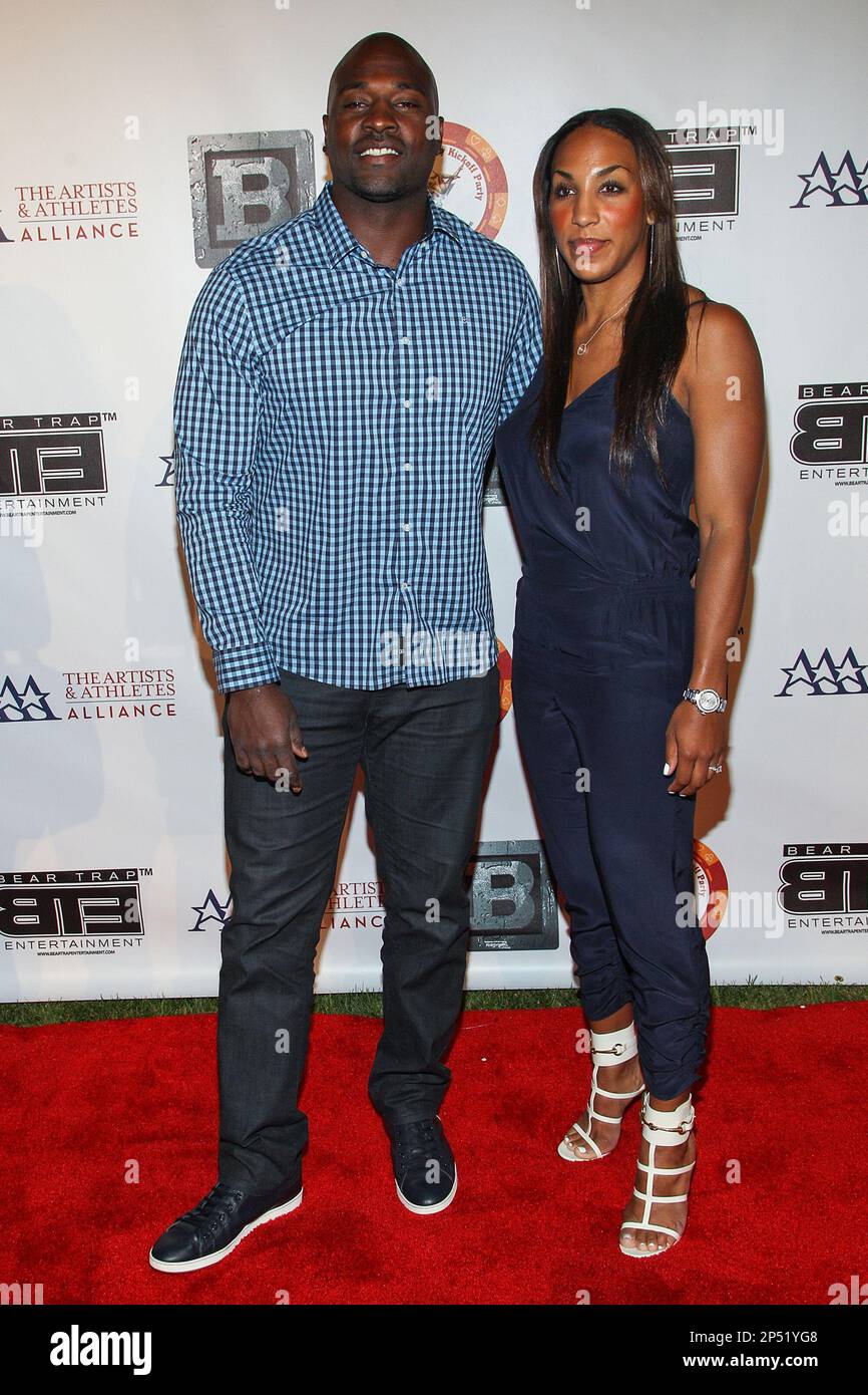 Professional football player Marcellus Wiley (L) attends the 8th Annual