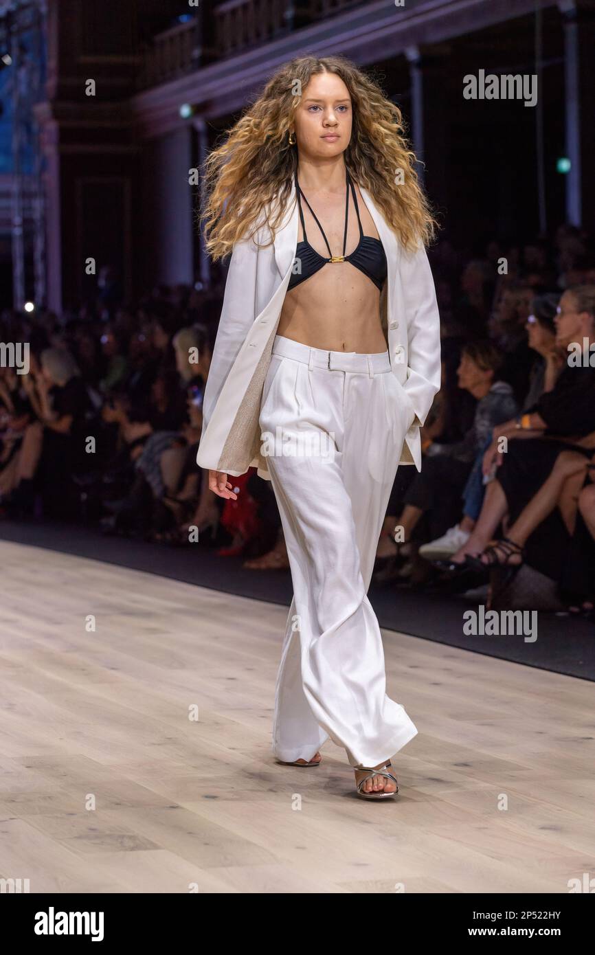 A model dressed by Maara Collective walks the runway at the Utopia runway show, showcasing the best of Australian fashion, as part of the Melbourne Fashion Festival, at the Royal Exhibition Building in Carlton, Melbourne. Australian designers take centre stage at the Melbourne Fashion Festival's first show, Utopia. The Royal Exhibition Building in Carlton will be the venue for this all-Australian lineup featuring designers such as Aje, Nevenka, Acler, Van Der Kooij, Ginger & Smart, Leo Lin, and Maara Collective. These designers will showcase their unique styles and cutting-edge fashion to the Stock Photo