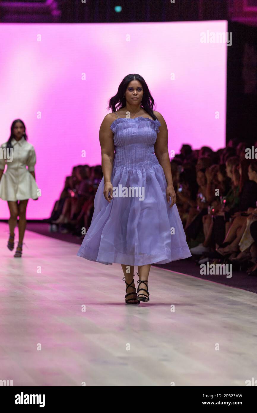 A model dressed by Aje walks the runway at the Utopia runway show, showcasing the best of Australian fashion, as part of the Melbourne Fashion Festival, at the Royal Exhibition Building in Carlton, Melbourne. Australian designers take centre stage at the Melbourne Fashion Festival's first show, Utopia. The Royal Exhibition Building in Carlton will be the venue for this all-Australian lineup featuring designers such as Aje, Nevenka, Acler, Van Der Kooij, Ginger & Smart, Leo Lin, and Maara Collective. These designers will showcase their unique styles and cutting-edge fashion to the world. The Me Stock Photo