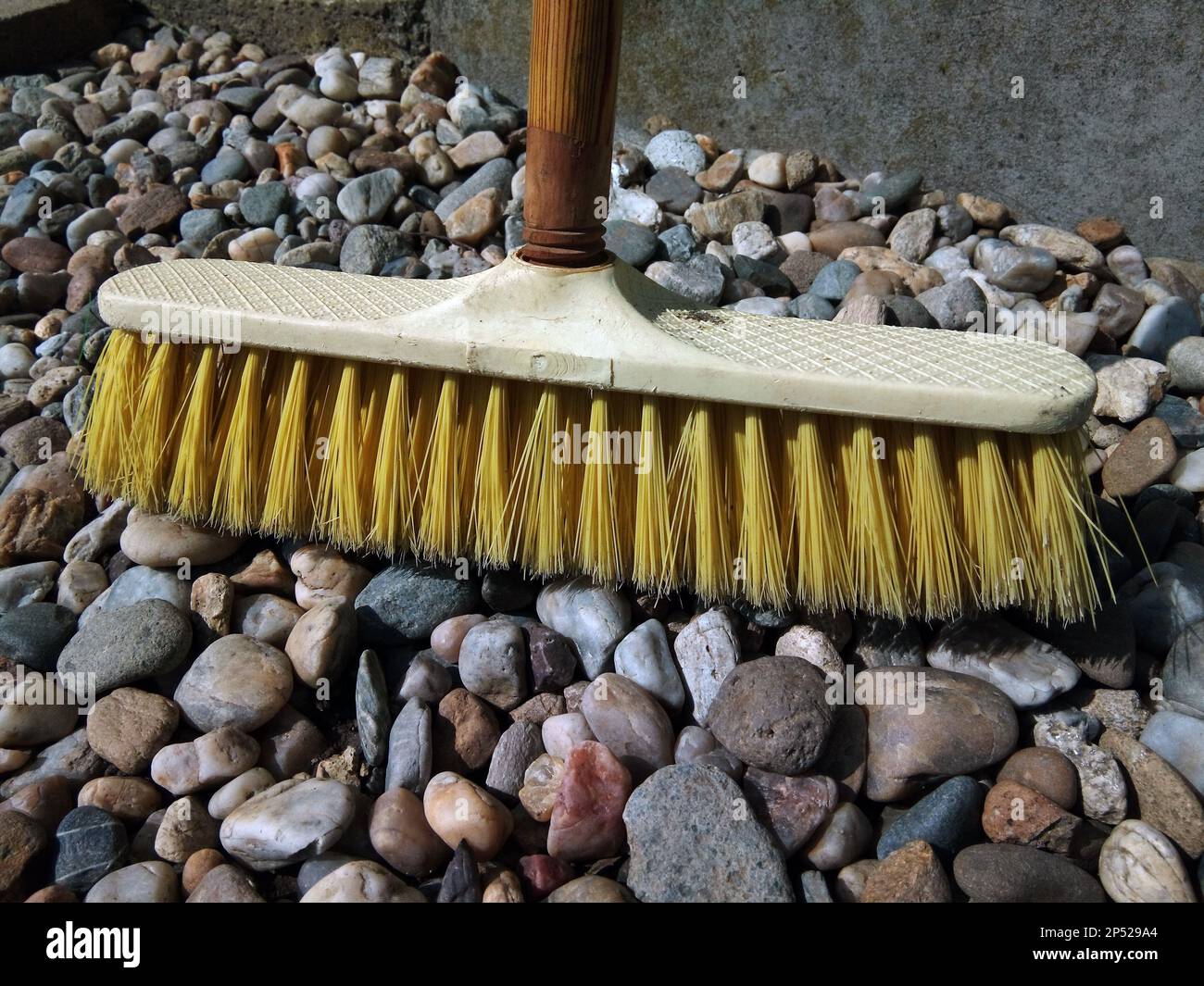 sweep on the rocks - tool Stock Photo - Alamy