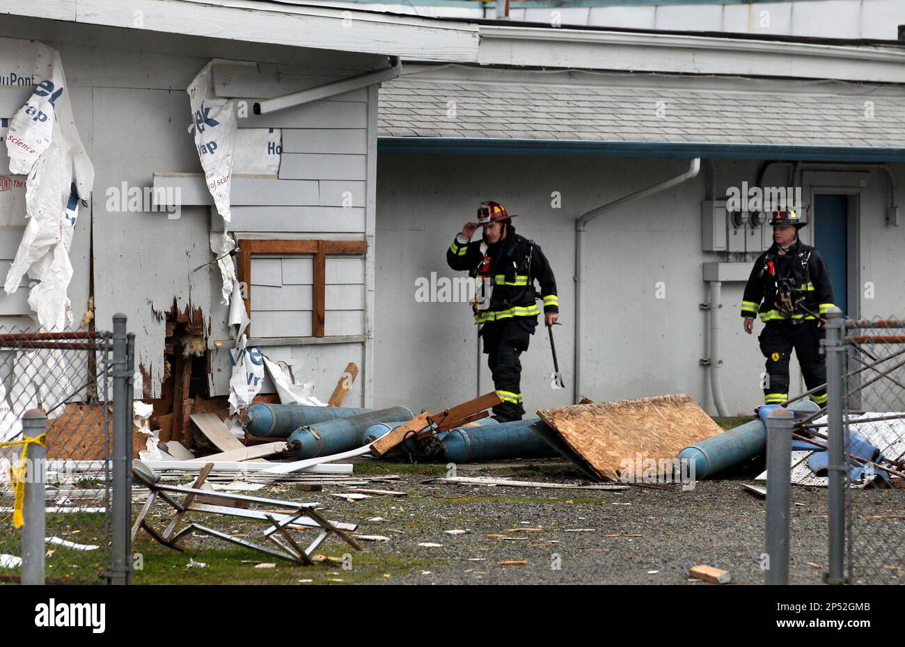 Olympia,Wash. firefighters Lt. Todd Carson, left, and Eric Hooft walk
