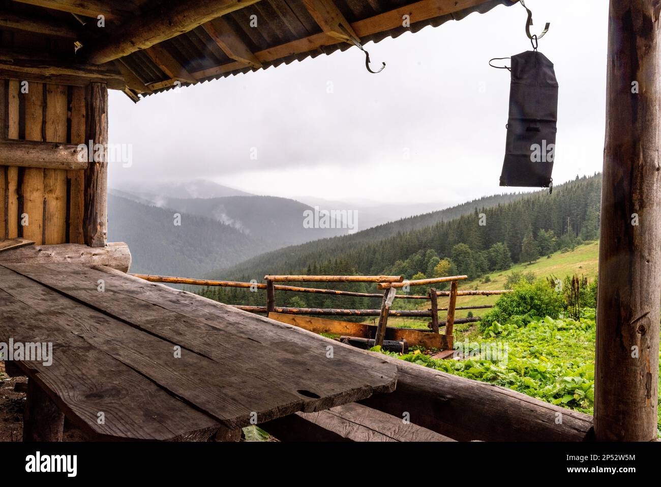 Mountain view from the hut. Charging the solar panel on the go. Charge the solar battery. Mountain View. Stock Photo