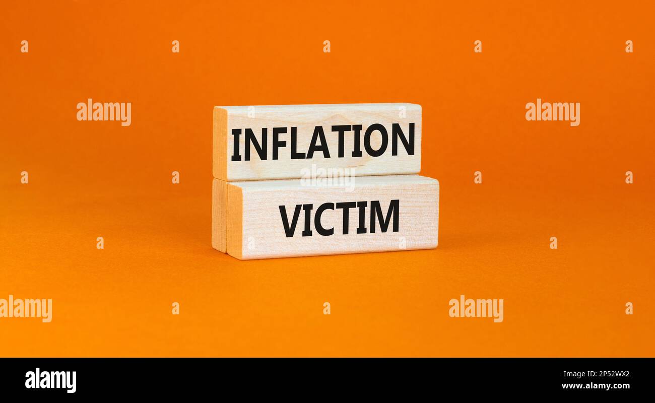 Inflation victim symbol. Concept words Inflation victim on wooden block ...