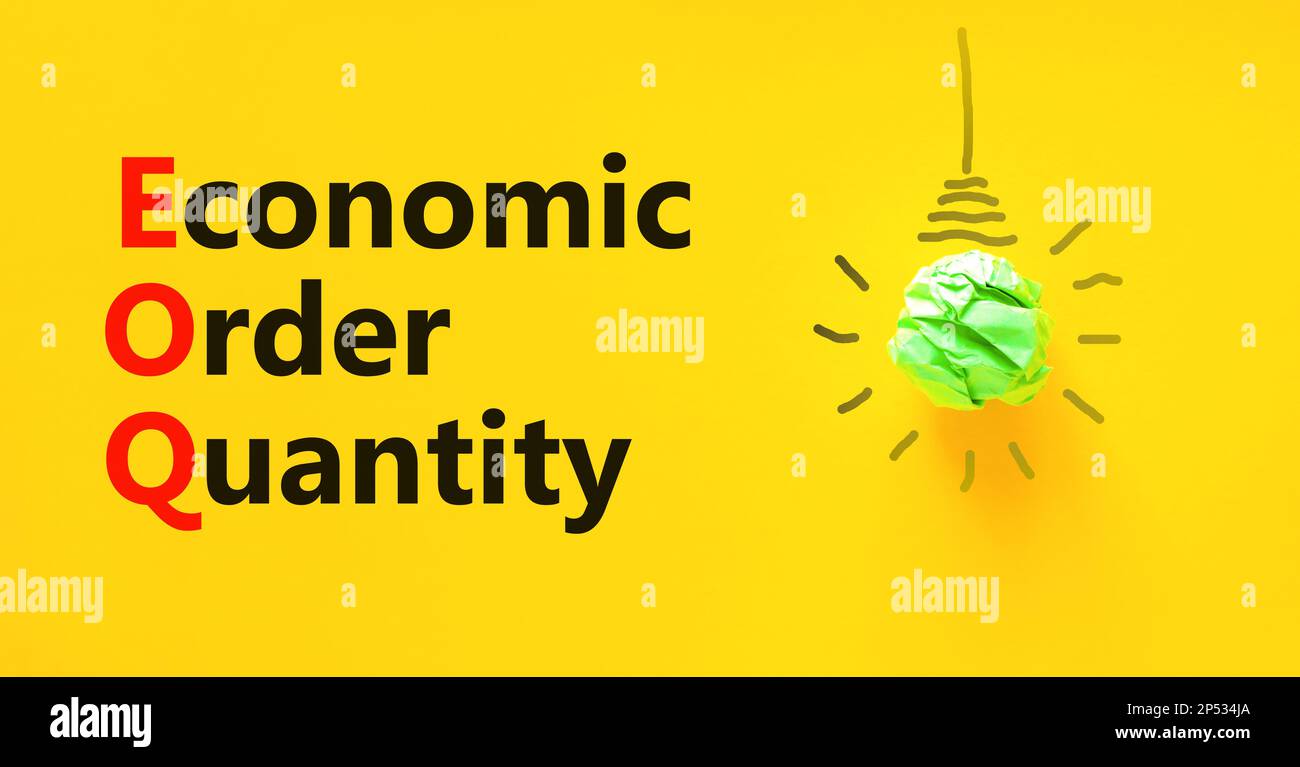 EOQ economic order quantity symbol. Concept words EOQ economic order quantity on paper on beautiful yellow background. Green light bulb icon. Business Stock Photo