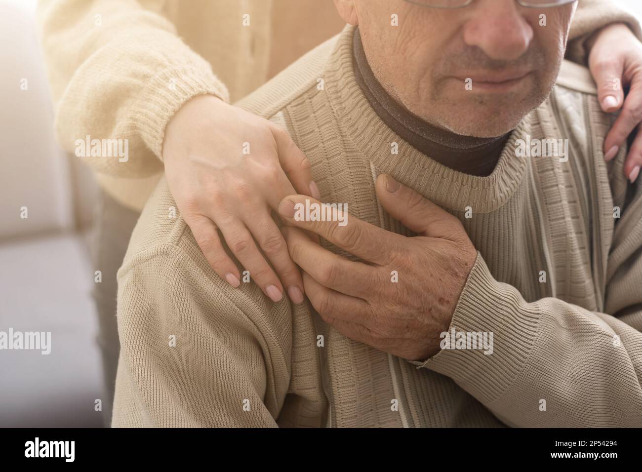 Young woman holding senior man hands, closeup Stock Photo