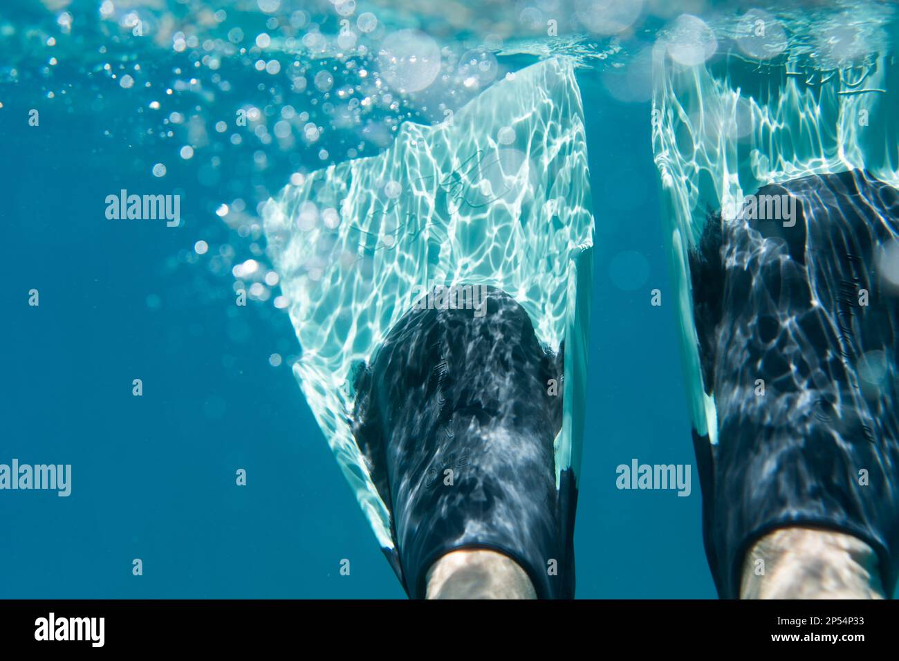 Swim fins and bubbles underwater Stock Photo Alamy