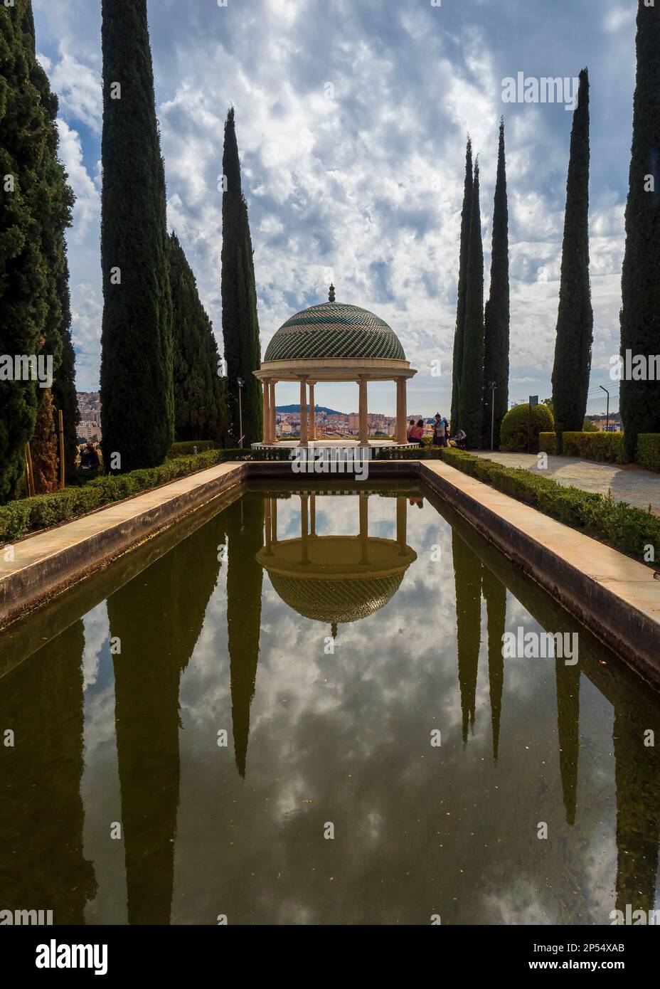 Reflection in the pond of the arbour of the botanical garden of La Concepcion in Malaga. Stock Photo