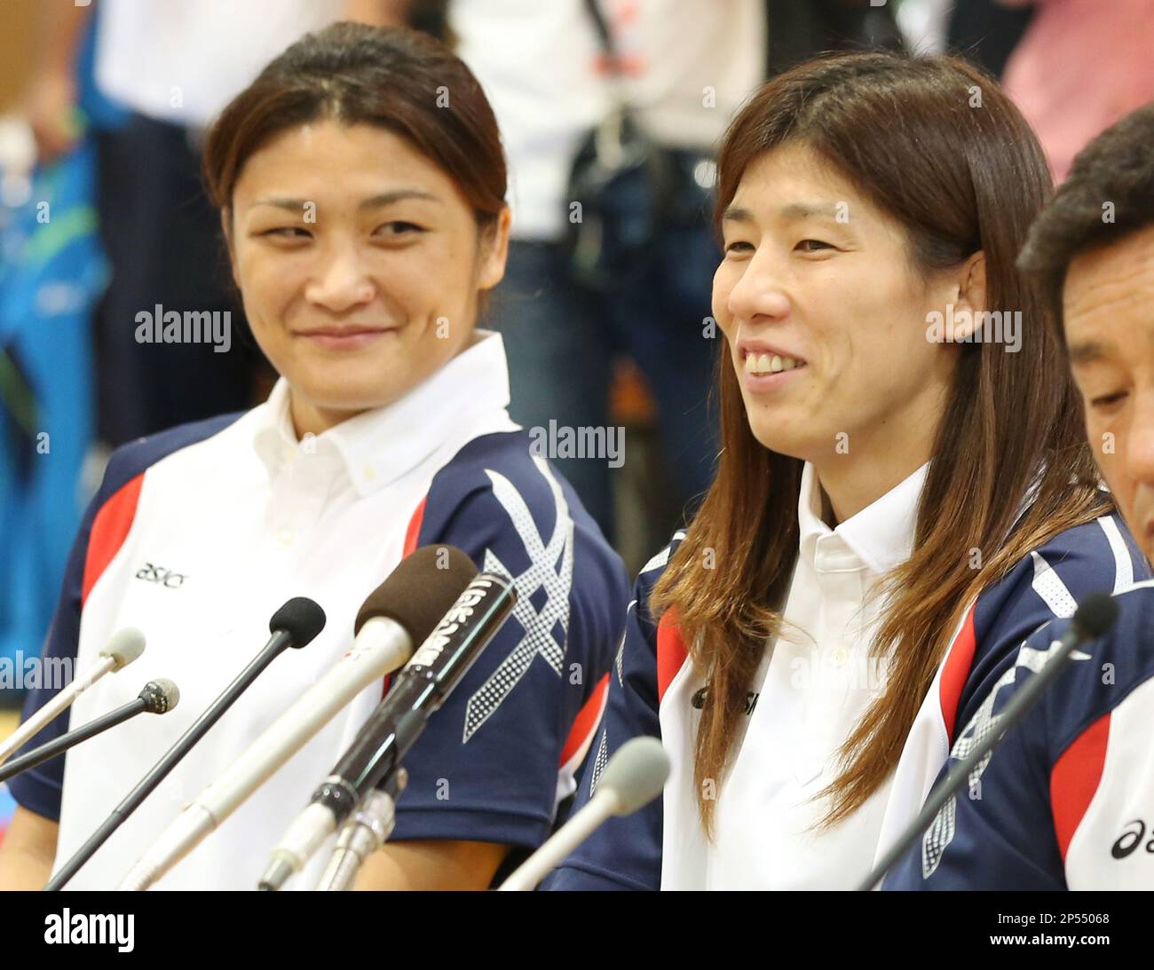 Japanese wrestlers Saori Yoshida (R) and Kaori Icho celebrate