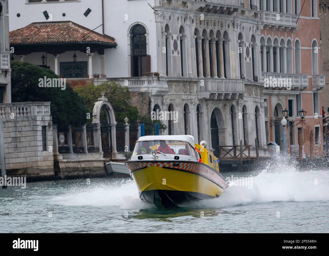 Water ambulance responding to an emergency travelling at speed through the Grand Canal, Venice, Italy Stock Photo