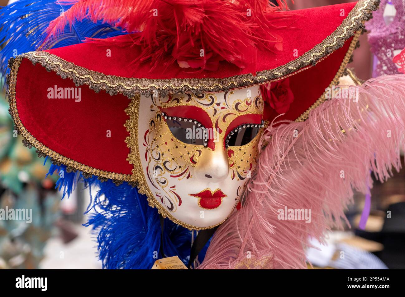 Face mask on display on a street venders stall, Venice, Italy. Stock Photo